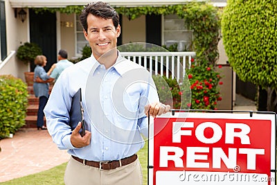 Real estate agent at work outside a property Stock Photo