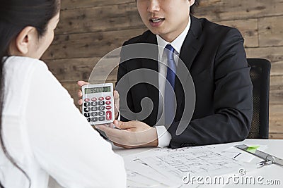 Real estate agents to calculate the rent Stock Photo