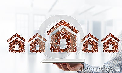 Real estate or construction idea presented by home icon on tablet pc Stock Photo