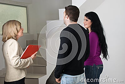 Real estate conversation with couple Stock Photo