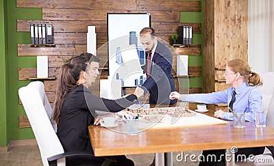 Real estate developer in buiness suit having a meeting with architects Stock Photo