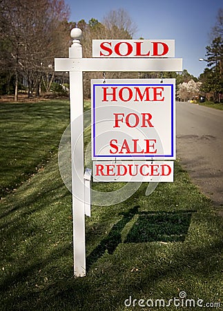 Real estate sign with sold and reduced Stock Photo