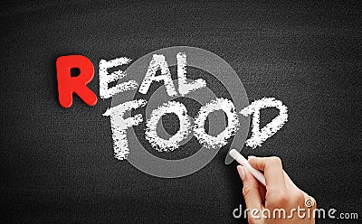 Real Food text on blackboard Stock Photo