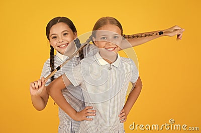 Real fun. happy friends on yellow background. fashion beauty. childhood happiness. sisterhood concept. small girls in Stock Photo