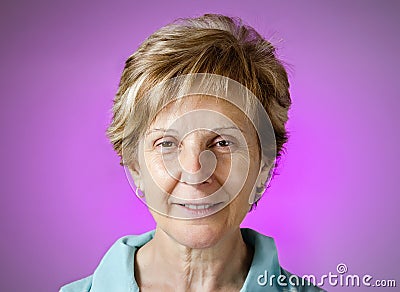 Real happy woman portrait over purple background Stock Photo