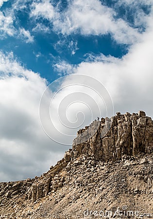 Real Heart shaped cloud in the sky above the high rocky mountains Stock Photo