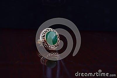 Real jade ring The bright green color is a gold ring suitable for men. Editorial Stock Photo