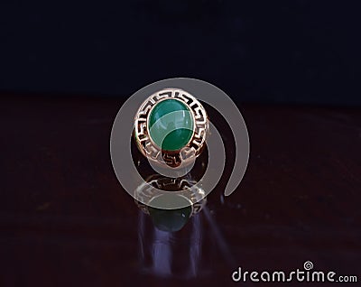 Real jade ring The bright green color is a gold ring suitable for men. Editorial Stock Photo