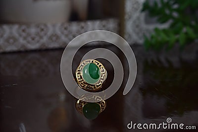 Real jade ring The bright green color is a gold ring suitable for men. Editorial Stock Photo