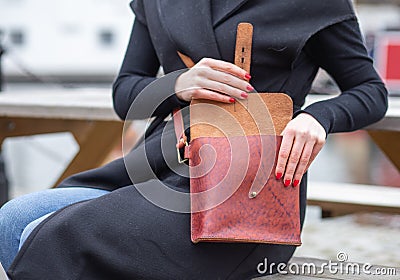 Real leather handbag opened in brown with model Stock Photo