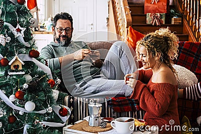 Real life leisure activity in chrismtas holiday at home for man and woman having breakfast together with italian coffee. Happiness Stock Photo
