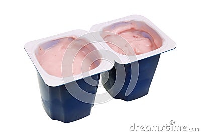 Real nonfat cherry yogurt in blue open plastic cups isolated macro Stock Photo