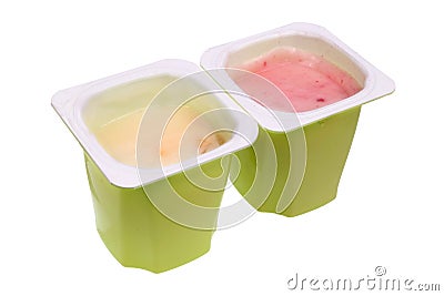 Real nonfat fruits yogurt in green open plastic cups isolated macro Stock Photo