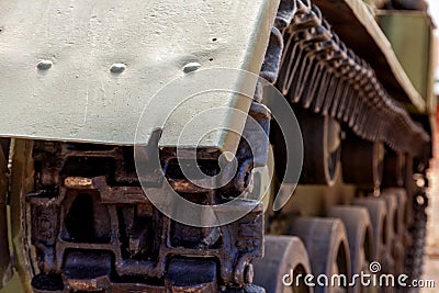 Real old heavy tracked tank and front roller. close up. steampunk detail background Stock Photo