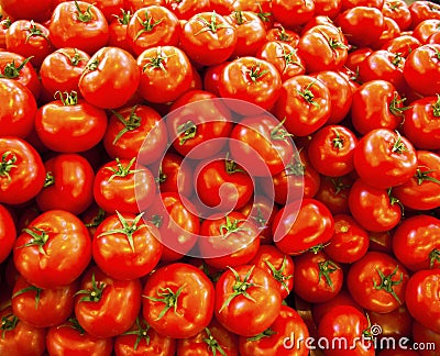 Real organic tomatoes at market stall Stock Photo