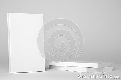 Real white book next to a stack of books on a gray background Stock Photo