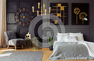 Dark grey bedroom interior with molding and painti Stock Photo