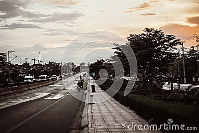 Real photo, sunset dark evening night sky background, nature beauty. View wide open suburb city asphalt roadway paved Editorial Stock Photo