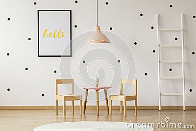 Real photo of a white ladder in a simple kind room interior with Stock Photo