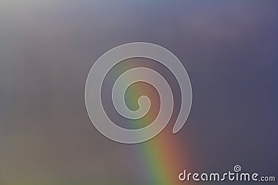 Real rainbow and dark sky Stock Photo