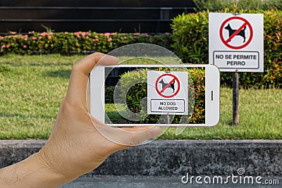 Real time Language Translation Augmented Reality, AR, App Concept Using Smartphone IOT to Translate Text on Sign from Spanish to E Stock Photo