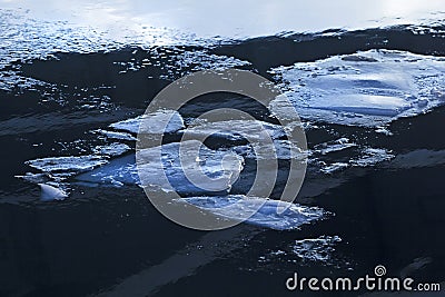 Real winter ice floes in dark cold water Stock Photo