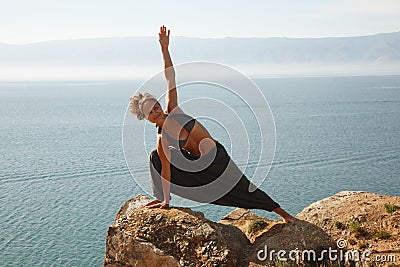 Real yoga instructor practicing Stock Photo