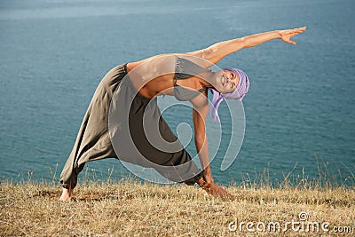 Real yoga instructor practicing Stock Photo