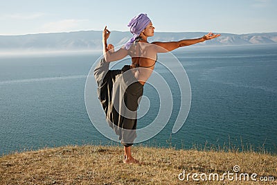 Real yoga instructor practicing Stock Photo