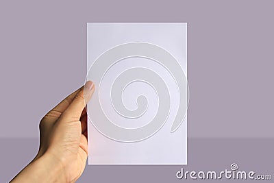 Realistic hand holding A5 paper mockup. Portrait A5 international paper size mockup Stock Photo