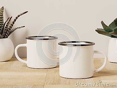 Two Camping Enamel Mugs with Succulent Plants in the Back Stock Photo