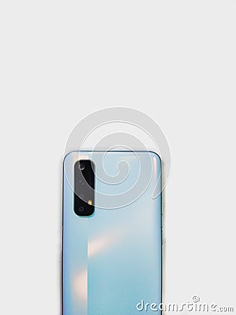 Realme 7 mist white camera in minimalist white background Editorial Stock Photo