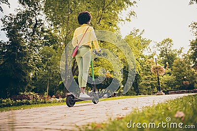 Rear back behind full length body size view of her she nice sporty slender fit thin wavy-haired girl enjoying riding Stock Photo