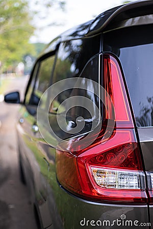 Rear lamp signals for turning car on street. Left back modern headlight car. Stock Photo