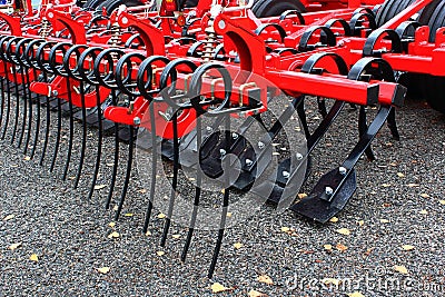 Rear part with spring rakes of modern british HE-VA Euro Tiller heavy duty secondary tine agricultural cultivator Editorial Stock Photo