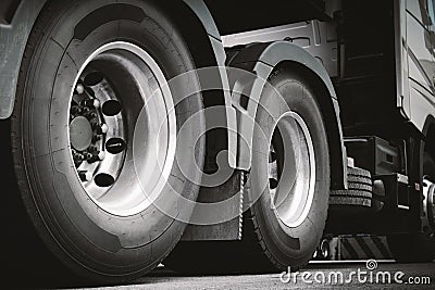 Rear of Semi Truck Wheels Tires. Diesel Truck. Freight Trucks Transport. Stock Photo
