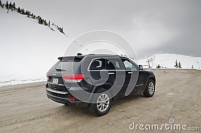 Rear shot of black Jeep Gran Cherokee around snow Editorial Stock Photo