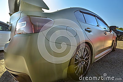 Rear side of a flat matte green car Stock Photo