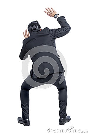 Rear view of Asian businessman afraid something Stock Photo