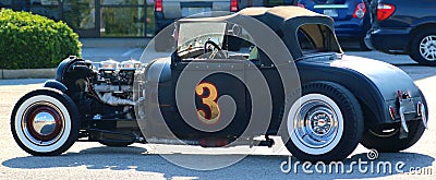 Rear View of Black 1940's Ford T-bucket antique convertible car. Editorial Stock Photo