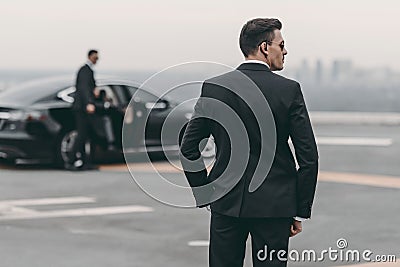 rear view of bodyguard in suit Stock Photo