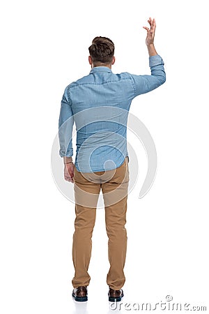 Rear view of a bothered casual man arguing and gesturing Stock Photo