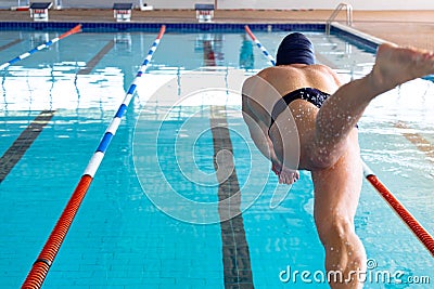 Swimmer plunging in the pool Stock Photo