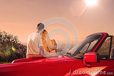 Rear view of couple hugging and admiring panorama Stock Photo