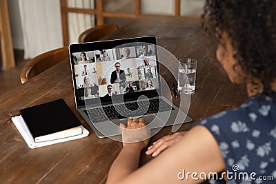 Back view of woman talk on video call with colleagues Stock Photo