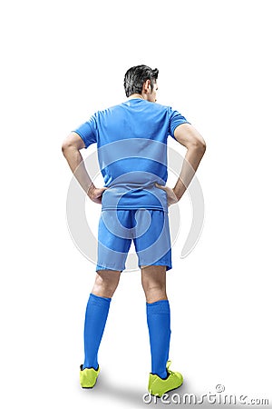 Rear view of football player man standing Stock Photo