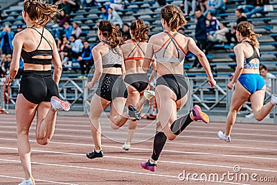rear view group female athlete runners running sprint race Editorial Stock Photo