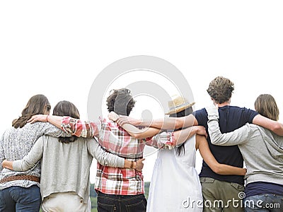 Rear View of Group of Friends Hugging Stock Photo