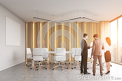 Rear view of a group of people discussing business stuff in a modern office conference room. Stock Photo
