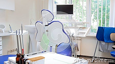 Rear view image of empty dentist chair in modern clinic Stock Photo